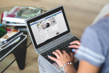 Woman typing on laptop