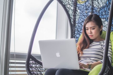 woman-in-chair-working-on-computer