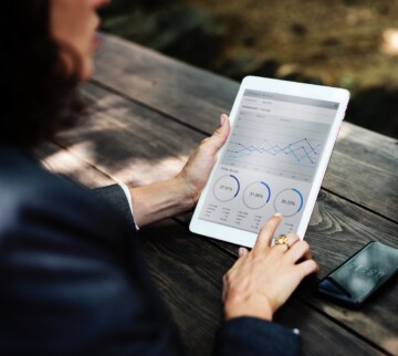 woman-using-tablet-to-check-google-analytics