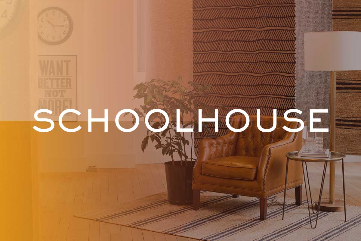 Schoolhouse logo on image of styled living room