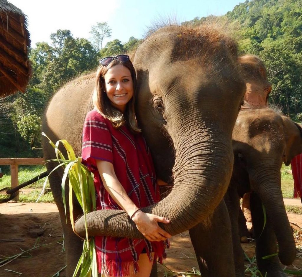 Woman with an elephant at a rescue in Thailand