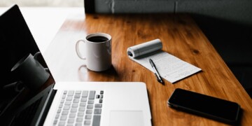 computer and coffee at desk