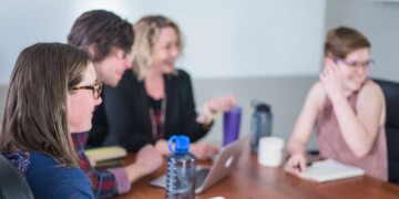 Group of people talking in office