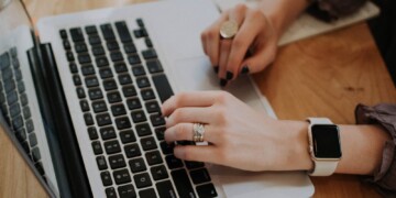 person typing on a laptop