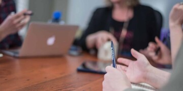 People talking around a board room table