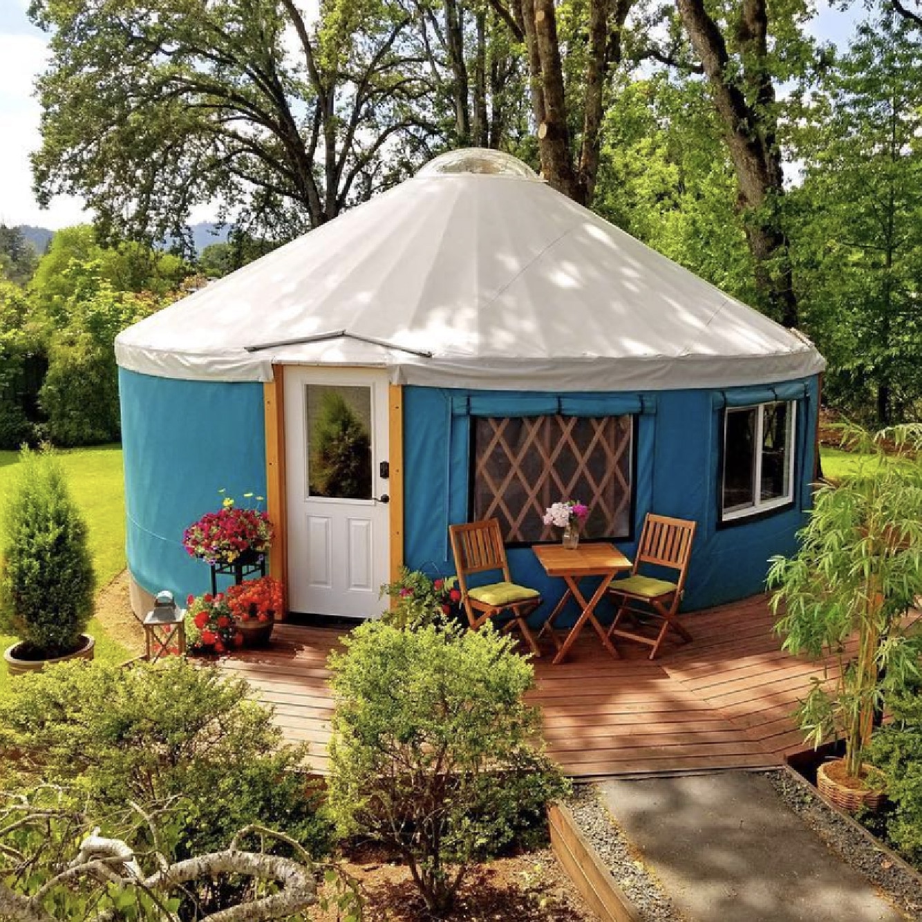 blue yurt with chairs and a blue roof