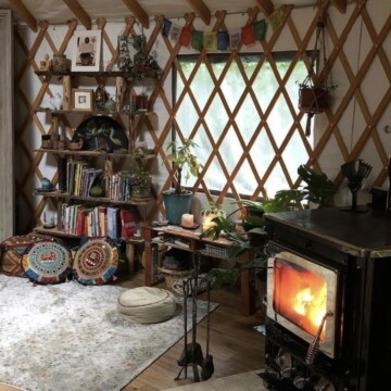 room with a fireplace and shelves