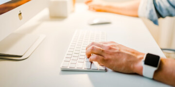 Person typing on computer