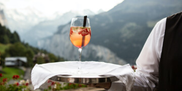 person holding a glass of wine