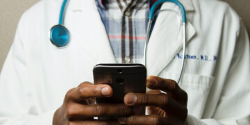 Doctor using smart phone
