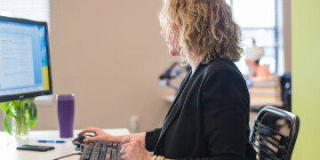 woman typing on computer