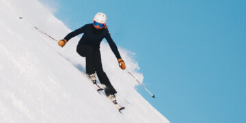 person skiing down a slope