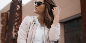 Woman wearing jacket and sunglasses