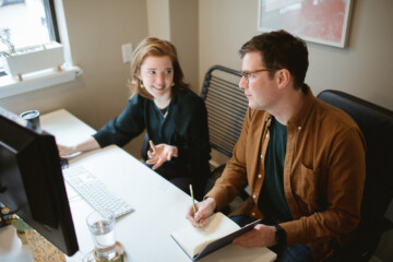Two people working in an office