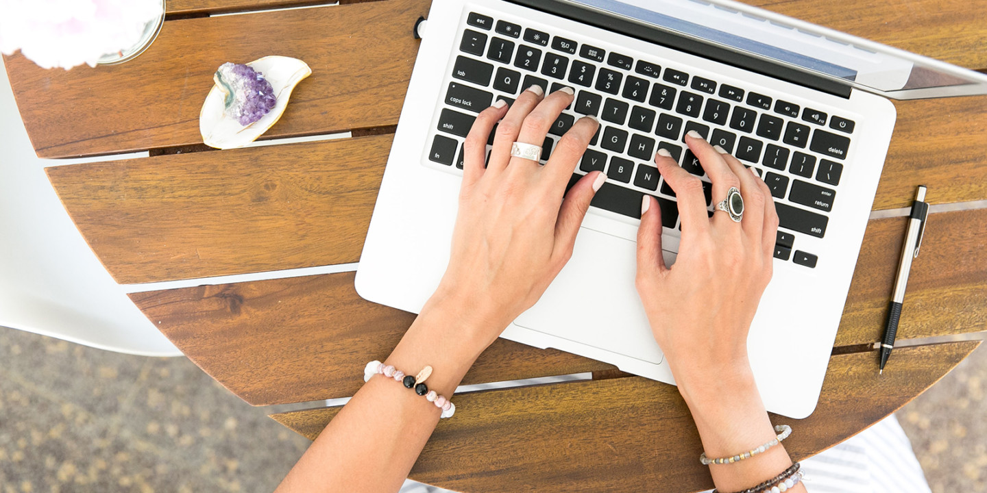 woman typing on a laptop