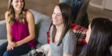 People laughing and talking in an office in Portland Oregon