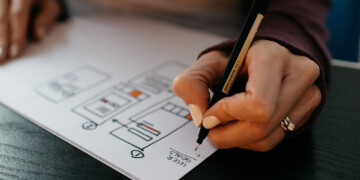 woman drawing a design plan