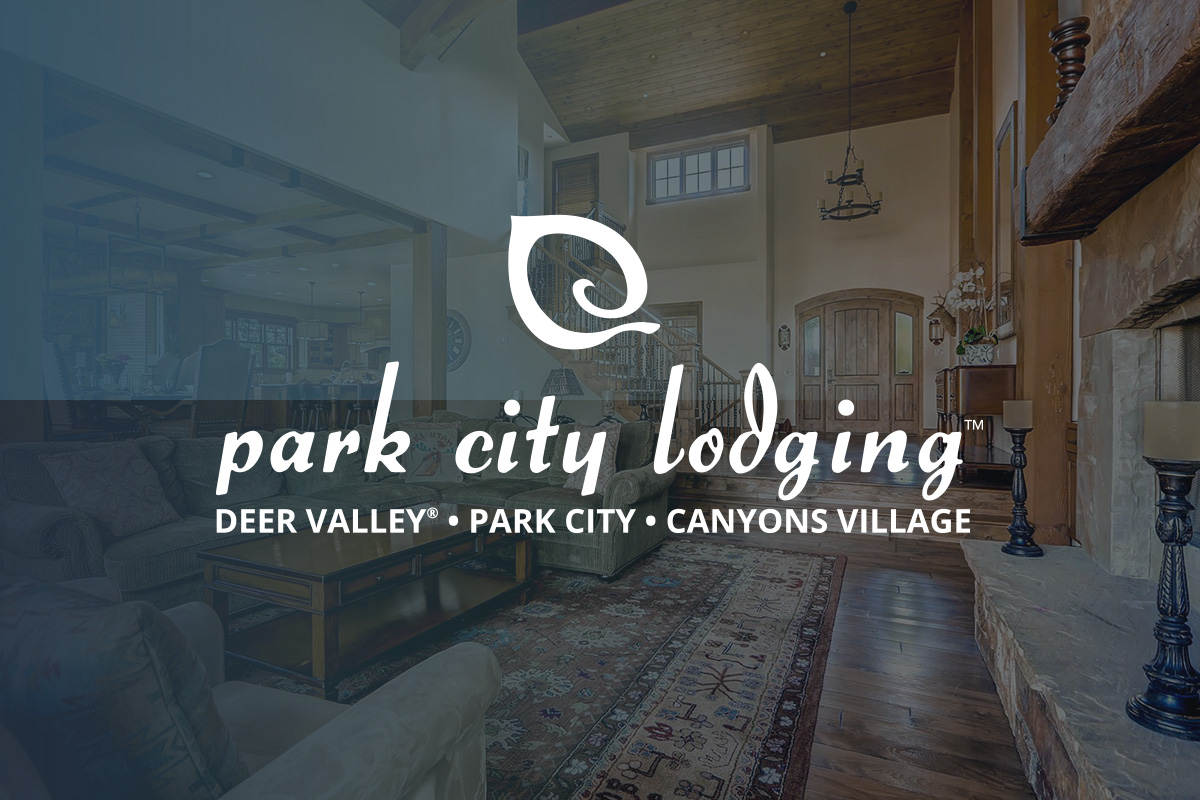 Park City Lodging logo on image of lodge living room