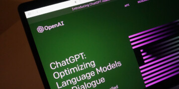 Open laptop showing how to use ChatGPT to optimize language models on the screen.