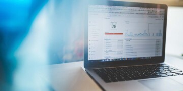 A laptop computer on a desk is open and showing the Google Analytics website.