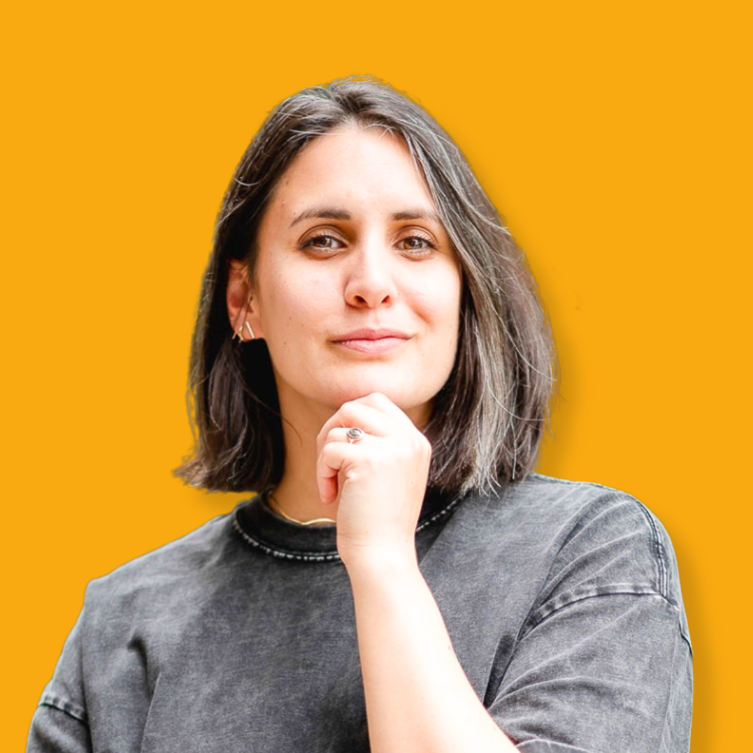 A headshot of Ariel Posey with a yellow background.