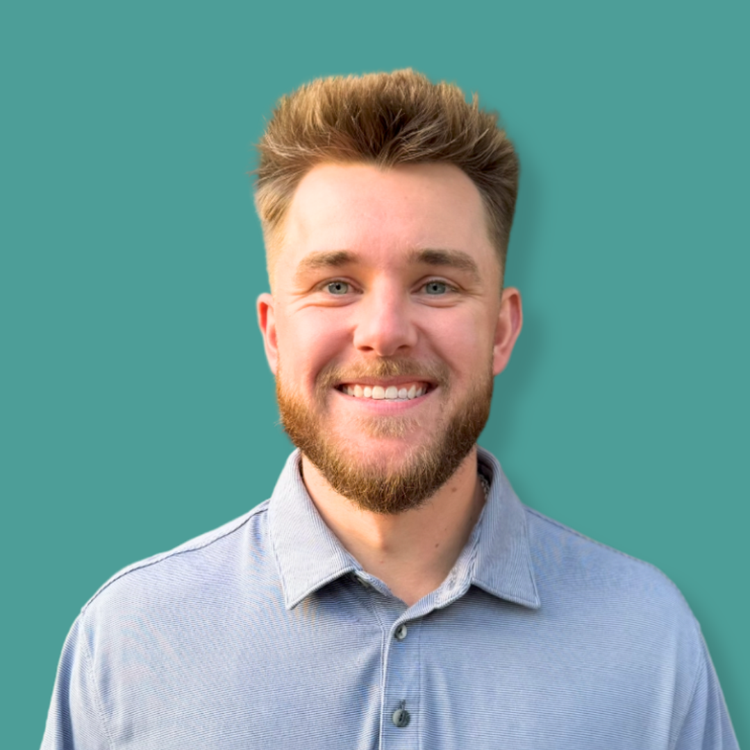 A headshot of Joey Clark with a teal background.